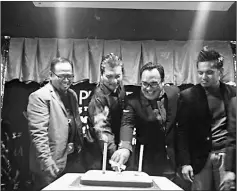  ??  ?? Idris (second left) and Jalot jointly cut the anniversar­y cake, witnessed by Maffizan (left) and Abdul Hadi.