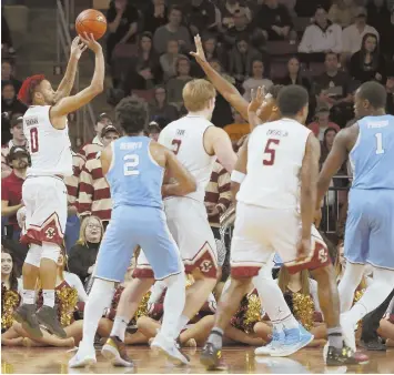  ?? AP PHOTO ?? ON FIRE: Boston College guard Ky Bowman (0), who scored 33 points, makes one of his seven 3-pointers during yesterday’s 90-82 loss to North Carolina at Conte Forum.