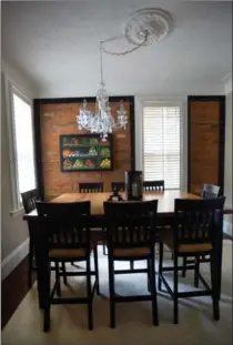  ?? BARRY GRAY PHOTOS, THE HAMILTON SPECTATOR ?? The custom dining room table is bar height so that the chairs can also be used at the kitchen island.