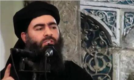  ?? Video via AP, File) ?? This image made from video posted on a militant website July 5, 2014, purports to show the leader of the Islamic State group, Abu Bakr al-Baghdadi, delivering a sermon at a mosque in Iraq during his first public appearance. The Islamic State is...