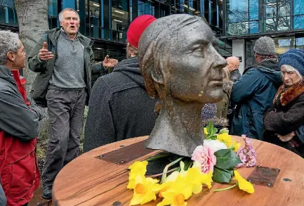  ?? PHOTO: JOSEPH JOHNSON/FAIRFAX NZ ?? Artist Sam Mahon, left, speaks to the gathered crowd while unveiling a sculpture of Catherine Sintenie.