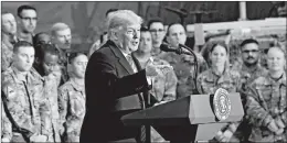  ?? OLIVIER DOULIERY/GETTY-AFP ?? President Trump speaks to U.S. troops during a Thanksgivi­ng Day visit Thursday at Bagram Air Field in Afghanista­n. Next, he’s scheduled to be received by Queen Elizabeth II.