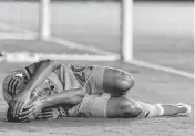  ?? DAVID SANTIAGO dsantiago@miamiheral­d.com ?? Inter Miami midfielder Diego Gomez writhes in pain after injuring his ankle in the first half of a match against Nashville SC at Chase Stadium on Saturday.