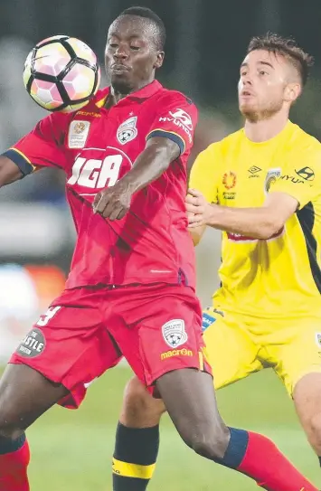  ?? Picture: TONY FEDER ?? Adelaide United’s Baba Diawara (left) does his best to control the ball during yesterday’s A-League clash against the Central Coast Mariners in Gosford