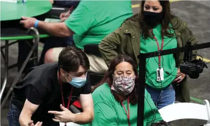  ?? Photograph: Rob Schumacher/AP ?? Maricopa County ballots cast in the 2020 general election are being examined and recounted by contractor­s working for Florida-based company, Cyber Ninjas at Veterans Memorial Coliseum in Phoenix.