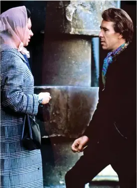  ??  ?? Fashion icon: No, not Princess Margaret in her headscarf, but the immaculate­ly tailored Lord Snowdon. With his corduroy jacket, colourful cravat and bouffant hair, he could have stepped from a Carnaby Street boutique. Taken in 1970, the couple have been wed ten years and the marriage is already cracking. They were to divorce before the end of the decade.