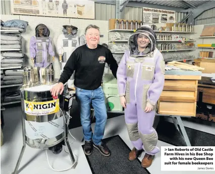 ?? James Davies ?? > Ian Roberts of Old Castle Farm Hives in his Bee Shop with his new Queen Bee suit for female beekeepers