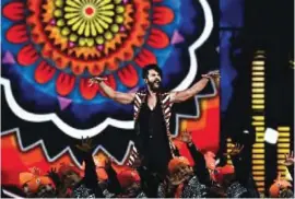  ??  ?? Bollywood actor Shahid Kapoor (center) performs on stage during 18th Internatio­nal Indian Film Academy (IIFA) Festival at the MetLife Stadium in East Rutherford, New Jersey, on Saturday.