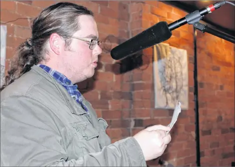  ?? TONY DAVIS/ THE GUARDIAN ?? Chiris Bailey reads poetry included in his upcoming book, “What Your Hands Have Done,” at the P.E.I. Writer’s Guild Open Mic June 14 at Receiver Coffee in Charlottet­own.