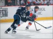  ?? PHOTO ADIRONDACK THUNDER/ANDY CAMP ?? The Thunder’s Kenton Miller, right, battles a Worcester opponent in ECHL Kelly Cup playoff action. Adirondack won, 3-1, on Sunday for a 2-1series lead. Game 4is at 7p.m. Wednesday in Glens Falls.