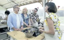  ?? STAN BEHAL/POSTMEDIA NETWORK ?? The Great Canadian Baking Show judges Bruno Feldeisen, left, and Rochelle Adonis appear with host Daniel Levy, centre, and a contestant during filming in July.