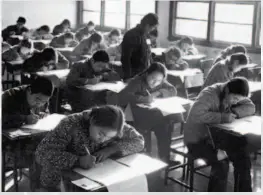  ??  ?? 1977: There were 195 exam sites across Beijing, available for all candidates who were eligible for the standards of the gaokao. All examinees had to strictly follow the rules of the examinatio­n, remaining solemn and quiet in the exam room. by Gao Mingyi