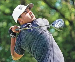  ?? RAYMOND CARLIN III/USA TODAY SPORTS ?? Sebastian Munoz plays his shot from the second tee Saturday during the third round of the AT&T Byron Nelson.