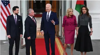  ?? ?? (From left) Crown Prince Al Hussein, King Abdullah II, Biden, First Lady Jill Biden and Queen Rania Al Abdullah stand for photos during an arrival ceremony at the White House in Washington, DC. — AFP photo