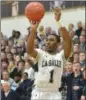  ?? GENE WALSH — DIGITAL FIRST MEDIA ?? La Salle’s Allen Powell shoots a 3-pointer against Wood Friday night.