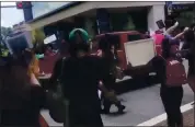  ?? @ALEXISNSCO­TT VIA AP ?? A pickup drives through a crowd of protesters Saturday in Tallahasse­e, Fla. No serious injuries were reported.