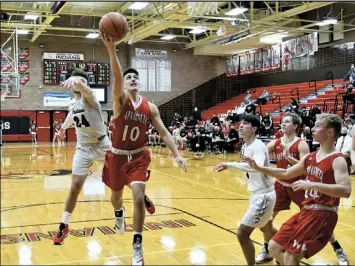  ?? Photos by John Zwez ?? Braeden Goulet of Wapakoneta gets paast Shawnee’s Tyson Elwer during Friday’s game. Looking on are Kaden and Garrett Siefring.