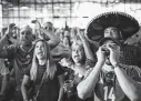  ?? Marie D. De Jesús / Staff file photo ?? Fans in Houston cheer the Mexican soccer team during the 2018 World Cup game against Brazil.