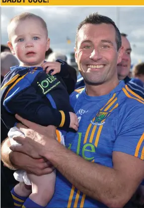  ??  ?? Wicklow defender Ciarán Hyland with his daughter Faye following the final whistle in the Leinster SFC clash with Offaly in O’Moore Park, Portlaoise, last Sunday.
