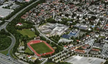  ?? Foto: Marcus Merk ?? Der Altbau des Gersthofer Paul-klee-gymnasiums (Bildmitte) soll durch einen Neubau auf dem Festplatz (unten rechts) ersetzt werden. Im Stadtrat wurde nun eine Änderung der Pläne für die Dreifachtu­rnhalle angeregt.