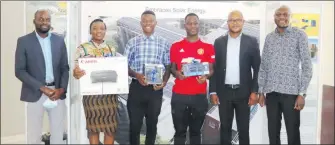  ?? Photo: Contribute­d ?? Weekly winners… Mission 1.5 Online Game Competitio­n Week 2 Winners with Ministry of Environmen­t, Forestry and Tourism Deputy Director for Multilater­al and Bilateral Agreements Petrus Muteyauli.