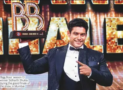  ?? Photos by IANS, PTI ?? ‘Bigg Boss’ season 13 winner Sidharth Shukla during the grand finale of the show, in Mumbai.