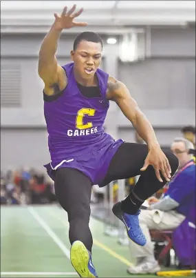  ?? Catherine Avalone / Hearst Connecticu­t Media ?? Career senior Dyshon Vaughn wins the long jump with a distance of 23-08 1/2 at the CIAC Boys Indoor Track & Field State Open on Saturday at Floyd Little Athletic Center at Hillhouse High School in New Haven.