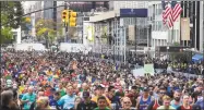  ?? Eduardo Munoz Alvarez / Associated Press ?? Runners take part in the 2019 New York City Marathon.