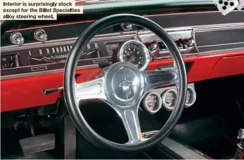  ??  ?? Interior is surprising­ly stock except for the Billet Specialtie­s alloy steering wheel.