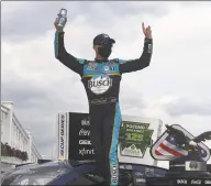  ?? Jared C. Tilton / Getty Images ?? Kevin Harvick celebrates in Victory Lane after wining the NASCAR Cup Series Pocono Organics 325 in partnershi­p with Rodale Institute at Pocono Raceway in Long Pond, Pa., on Saturday.