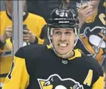  ?? Pittsburgh Post-Gazette ?? Evgeni Malkin is all smiles after scoring his second goal Thursday against the Wild Thursday at PPG Paints Arena.