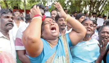  ??  ?? Well wishers of Tamil Nadu Chief Minister Jayalalith­aa cry outside a hospital where Jayalalith­aa is being treated in Chennai.