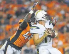  ?? Helen H. Richardson, The Denver Post ?? Broncos outside linebacker Shaquil Barrett sacks Chargers quarterbac­k Philip Rivers in Monday night’s game at Sports Authority Field at Mile High.