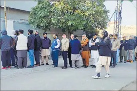  ?? ?? People stand in a queue to cast their votes for the Pakistan Election 2024, in Lahore on Thursday. ANI