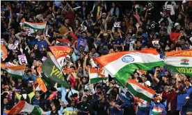  ?? Photograph: William West/AFP/Getty Images ?? India supporters show their delight after Virat Kohli’s stunning six against Pakistan in the T20 World Cup.