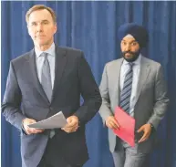  ?? FRANK GUNN / THE CANADIAN PRESS FILES ?? Finance Minister Bill Morneau, left, and Minister of Innovation, Science and Industry Navdeep Bains
unveiled loan help for big business Monday.