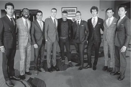  ?? Photos by Pam Cress, Special to The Denver Post ?? Founder/ceo Dmitry Metsaev and associate Angelo Ogata, fifth and sixth from left, stand with the models who showed the latest in men's fashion from Icon Custom Suits-denver.