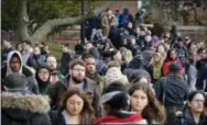  ?? THE ASSOCIATED PRESS ?? Brooklyn College students walk between classes on campus in New York. A new analysis of government data by the Consumer Federation of America found that the number of Americans in default on their student loans jumped by nearly 17 percent last year.