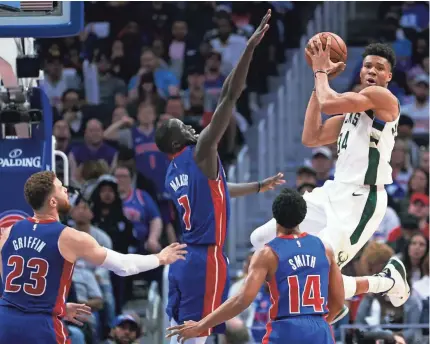  ?? RICK OSENTOSKI/USA TODAY SPORTS ?? The Bucks and forward Giannis Antetokoun­mpo dominated the Pistons in their sweep of the first-round series to advance to the Eastern Conference semifinals for the first time since 2001.