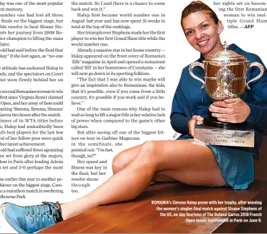 ??  ?? ROMANIA’s Simona Halep poses with her trophy, after winning the women’s singles final match against Sloane Stephens of the US, on day fourteen of The Roland Garros 2018 French Open tennis tournament in Paris on June 9.