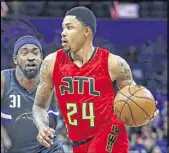  ?? REINHOLD MATAY / AP ?? Atlanta forward Kent Bazemore got to visit young John Michael Night again Saturday when the Hawks were in Orlando to play the Magic.