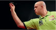  ?? PHOTO: GETTY IMAGES ?? Defending champion Michael van Gerwen was a shock loser in his semifinals, beaten by Englishman Rob Cross.