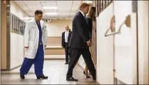  ?? AL DRAGO / NEW YORK TIMES ?? President Donald Trump and first lady Melania Trump visit Broward Health North Hospital in Pompano Beach, Fla., on Friday to meet with the shooting victims from Marjory Stoneman Douglas High School in Parkland, Fla.