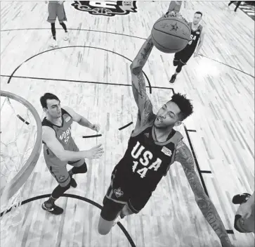  ?? Ronald Martinez Getty Images ?? LAKERS ROOKIE Brandon Ingram soars for a dunk during the first half of the Rising Stars Challenge.