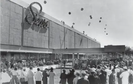  ?? THE COMMERCIAL APPEAL FILES ?? Sears, Roebuck and Co. opened a new multi-million dollar store on Poplar Avenue on May 7, 1958. Within a half hour after the doors were opened at 9:30 a.m., the 1,000-car parking lot was jammed. Before nightfall, Sears officials estimated the crowd at more than 25,000 and the evening visitors pushed the total to 40,000.