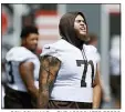  ?? RON SCHWANE — THE ASSOCIATED PRESS ?? Jedrick Wills warms up before Browns practice Aug. 12 in Berea.