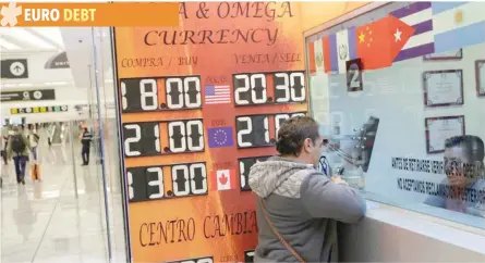  ?? — Reuters ?? A board displaying the exchange rates of Mexican peso against the US dollar and the euro is seen at a foreign exchange shop in Mexico City.