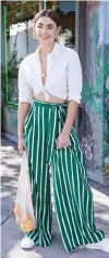  ??  ?? Easy and carefree fashion with Forever 21’s white top and striped palazzo pants.