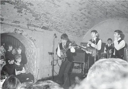  ?? Apple Corps Ltd. ?? THE BEATLES perform at the Cavern in Liverpool, England, in 1962, not long after drummer Ringo Starr joined the band.