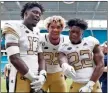  ??  ?? Georgia Tech’s Demetrius Knight II (from left), Sylvain Yondjouen and former Rome High♦standout Jamious Griffin celebrate after Saturday’s win at Miami.
